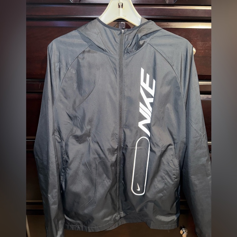 Unisex Black Nike Running Jacket. Size Medium